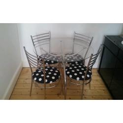 Glass dinning table and 4 chairs