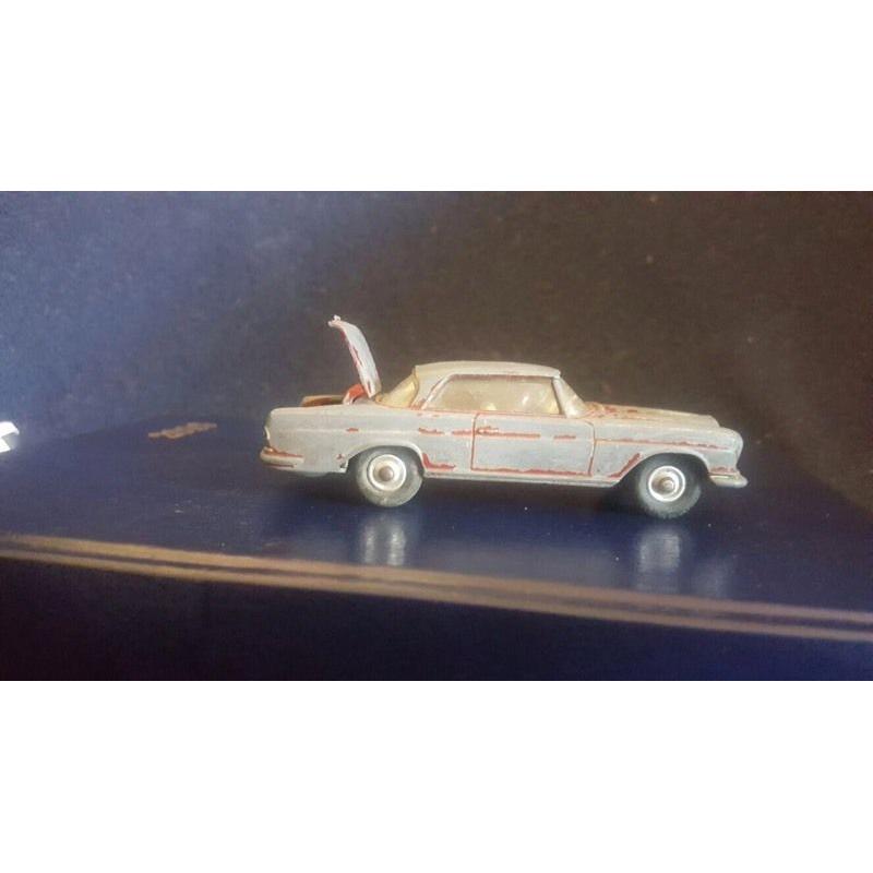 A selection of vintage old used corgi vehicles