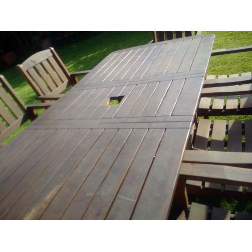 SOLID WOODEN GARDEN TABLE AND 8 CHAIRS