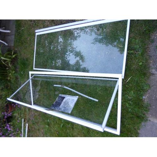 Plain glass hinged shower door with glass side panel + extra side panel, unused.