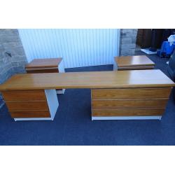 Dressing table and two matching bedside cabinets in teak and cream.