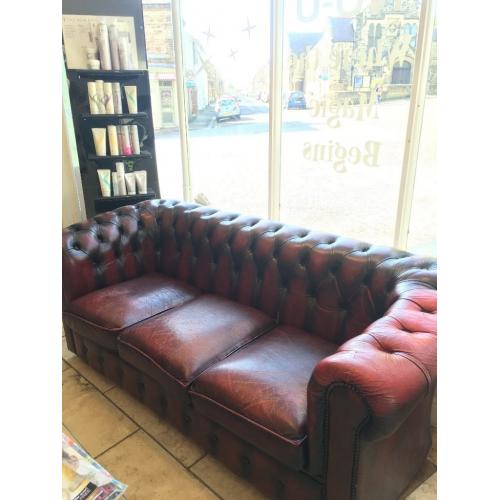 Aged vintage chesterfield sofa