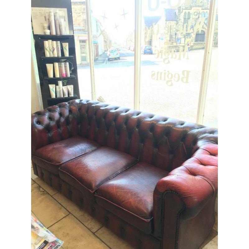 Aged vintage chesterfield sofa