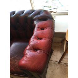 Aged vintage chesterfield sofa