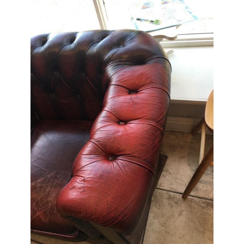 Aged vintage chesterfield sofa
