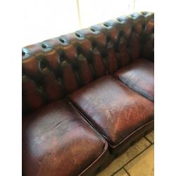 Aged vintage chesterfield sofa