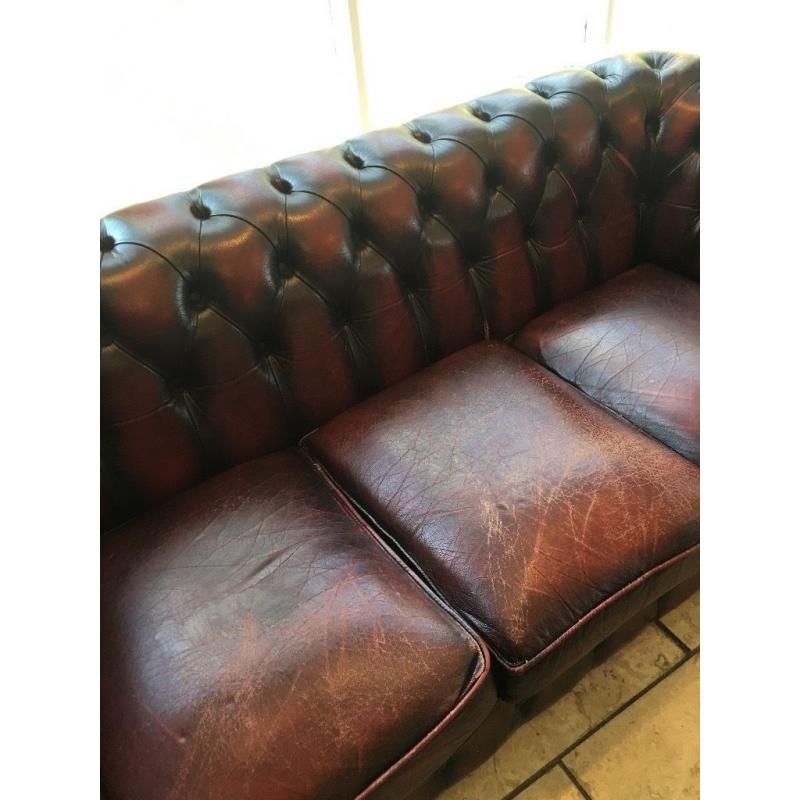 Aged vintage chesterfield sofa