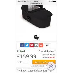 Baby Jogger Black Deluxe Carry Cot in Black with adaptors.