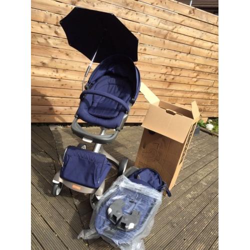 Hardly Used Stokke Xplory V4 with carrycot, car seat adaptors, parasol and cup holder
