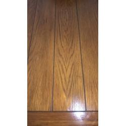 Extending Oak Dining Table and Four Brown Faux Leather Chairs
