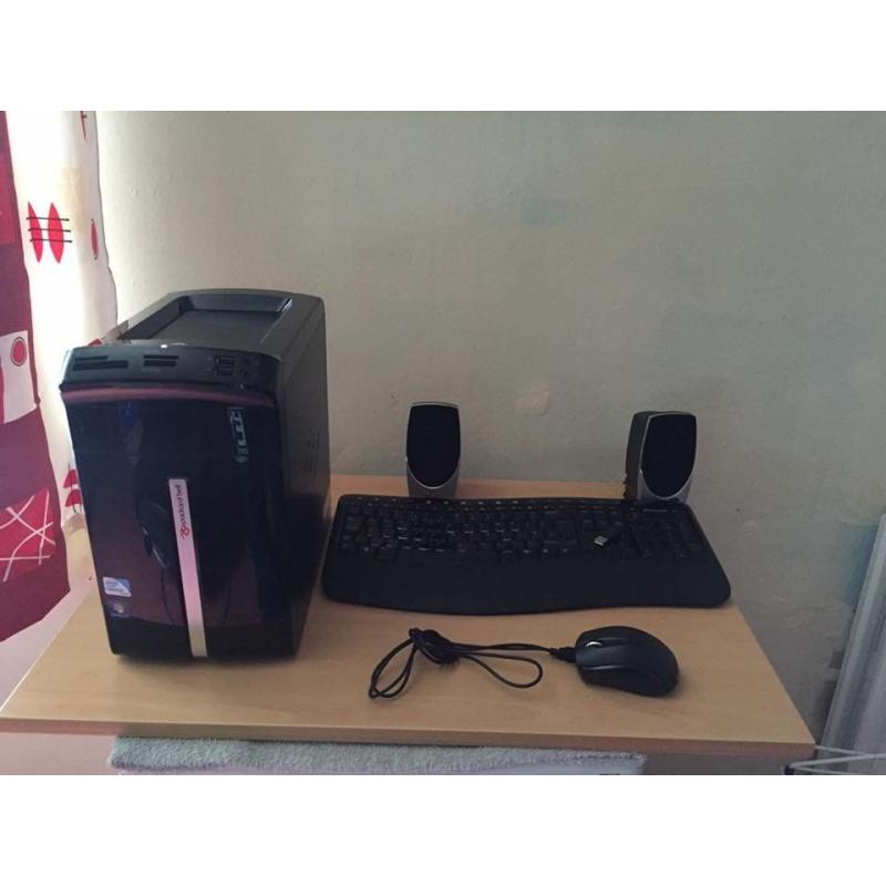 desktop with mouse keyboard speakers