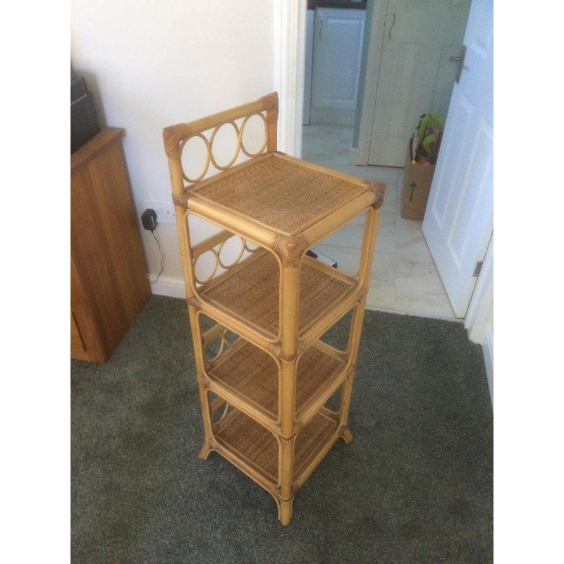 Wicker shelf unit .