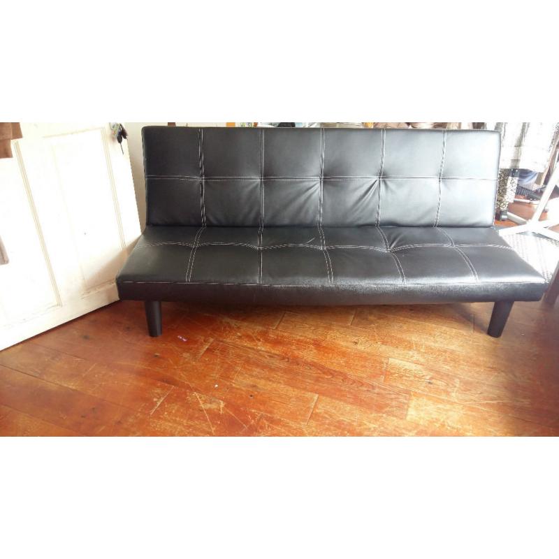 three seated Faux Leather black Sofa bed nearly new