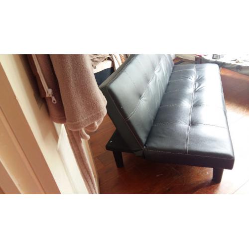 three seated Faux Leather black Sofa bed nearly new