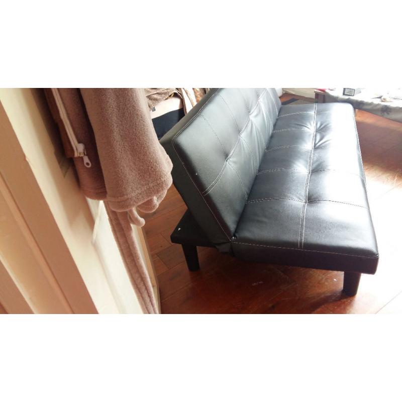 three seated Faux Leather black Sofa bed nearly new