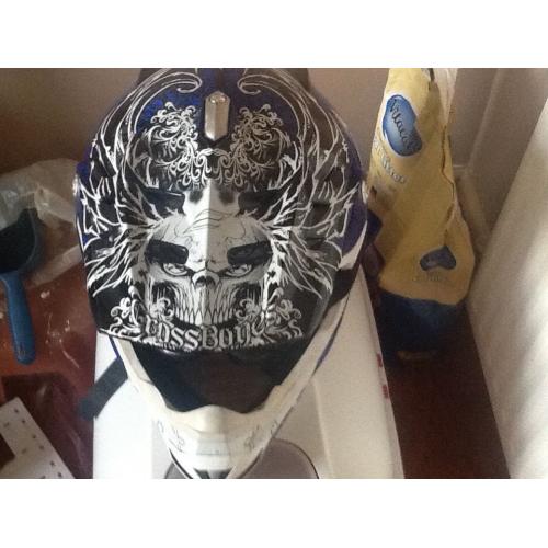Two adults small motor cross helmets