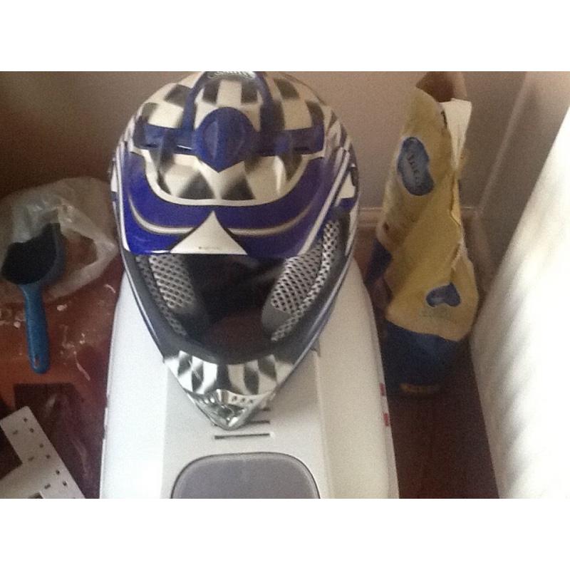 Two adults small motor cross helmets
