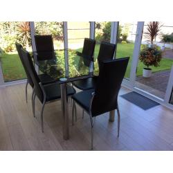 Glass and chrome dining table and chairs