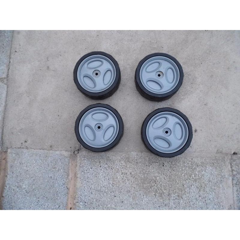 4 x plastic lawnmower wheels used.