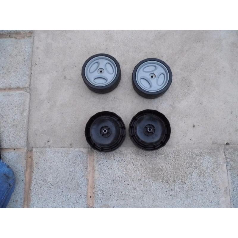 4 x plastic lawnmower wheels used.