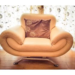 Faux leather 3 and 1 seater beige sofas in good condition.