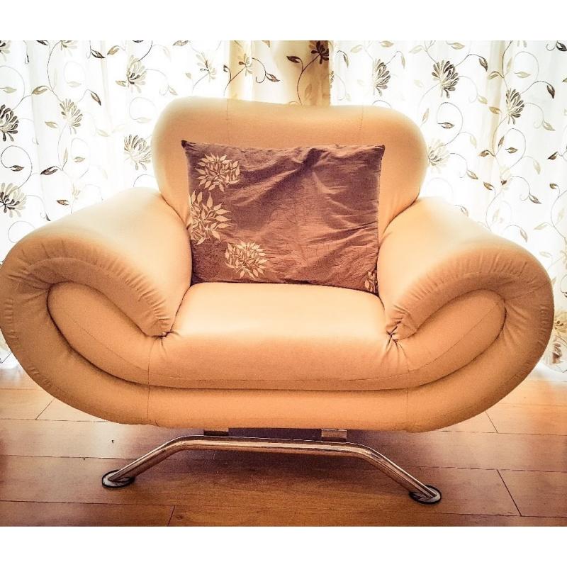 Faux leather 3 and 1 seater beige sofas in good condition.