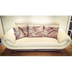 Faux leather 3 and 1 seater beige sofas in good condition.