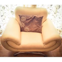 Faux leather 3 and 1 seater beige sofas in good condition.