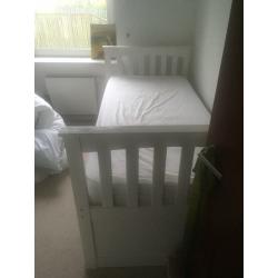 Single bed that slides into a double bed