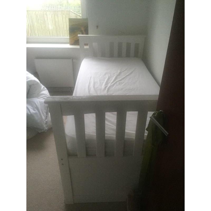 Single bed that slides into a double bed