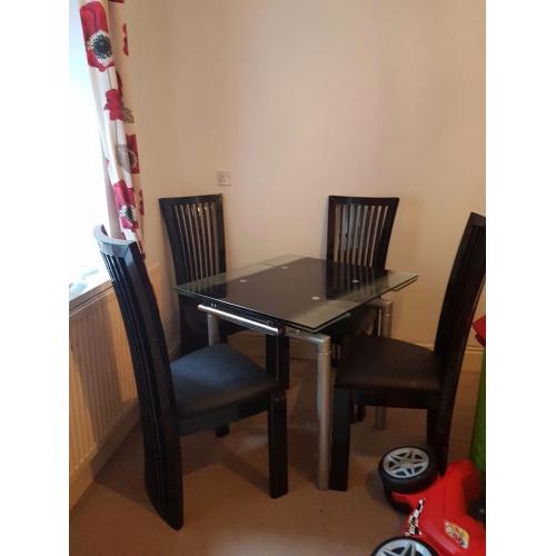 Expendable table with four heavy chairs