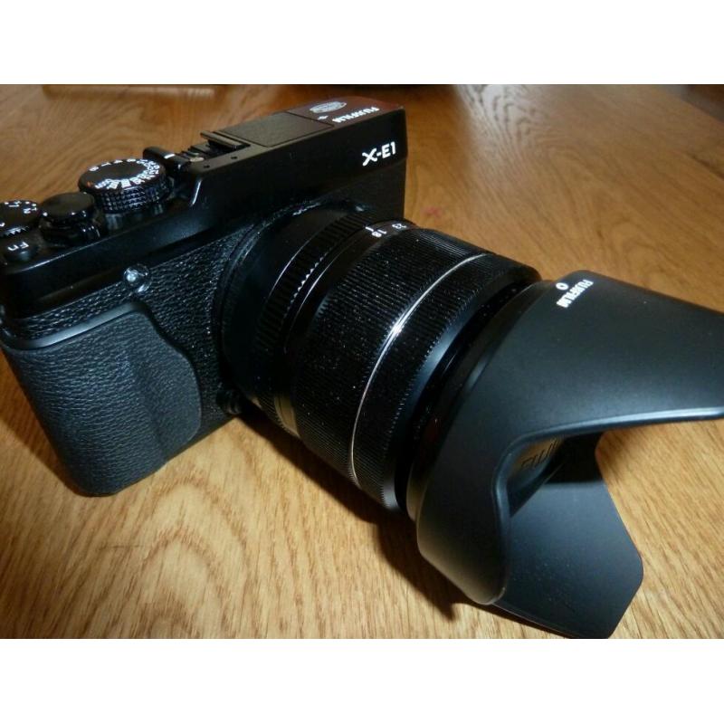 Fuji XE1 mirrorless compact with XF 18-55 lens plus extras.