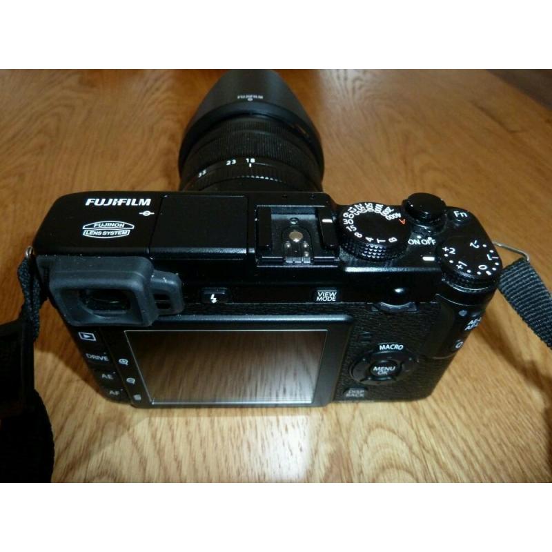 Fuji XE1 mirrorless compact with XF 18-55 lens plus extras.
