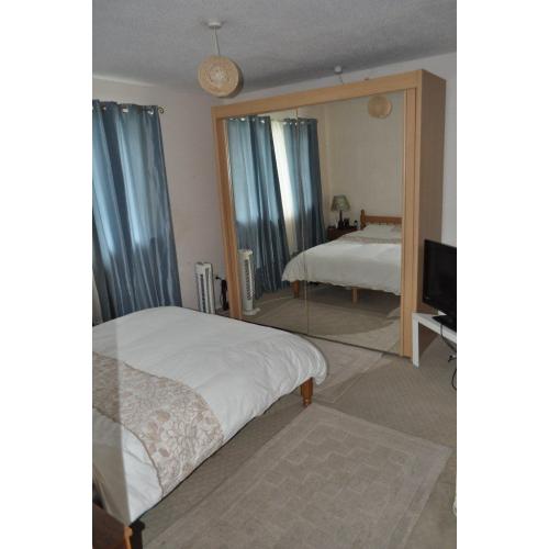 Reduced price! Large wooden wardrobe with double sliding mirrors. Offer ends this week!