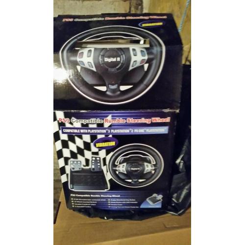 Kids steering wheel and pedals, compatible with Ps3 ps2 used once and boxed.