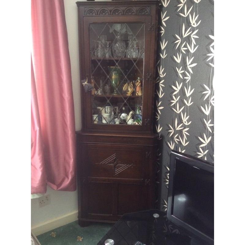 Dark wood vintage corner display unit with glass cabinet