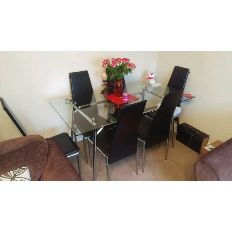 Glass table with 6 chairs