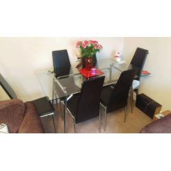 Glass table with 6 chairs
