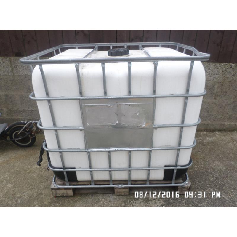 1,000 litre plastic tank in metal frame ,,,,