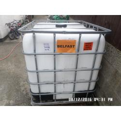 1,000 litre plastic tank in metal frame ,,,,