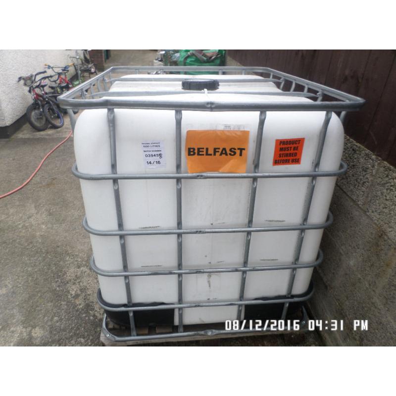 1,000 litre plastic tank in metal frame ,,,,