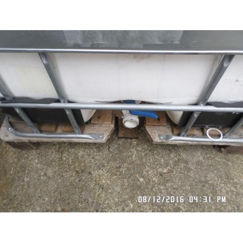 1,000 litre plastic tank in metal frame ,,,,