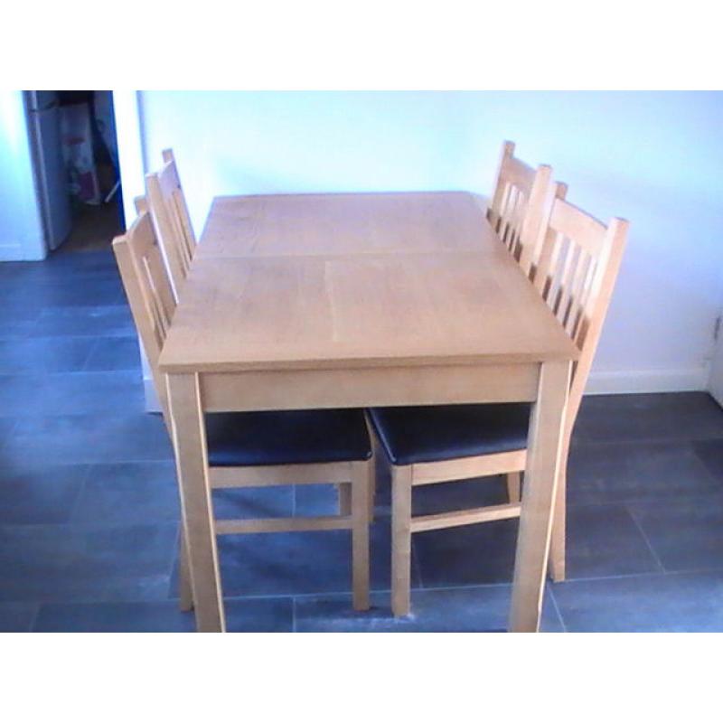 wooden dininig table and 4 chairs. Middle section to make table bigger also