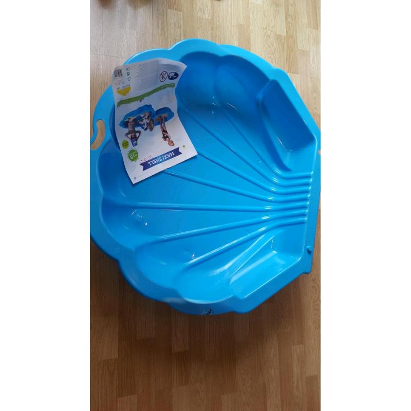 Blue shell sandpit and paddling pool