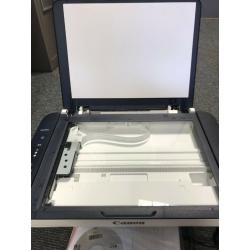 Canon printer/scanner/photocopier in great condition, like new, free printing paper and notebooks