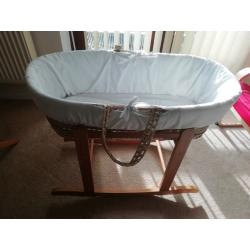 Moses basket with rocking stand.