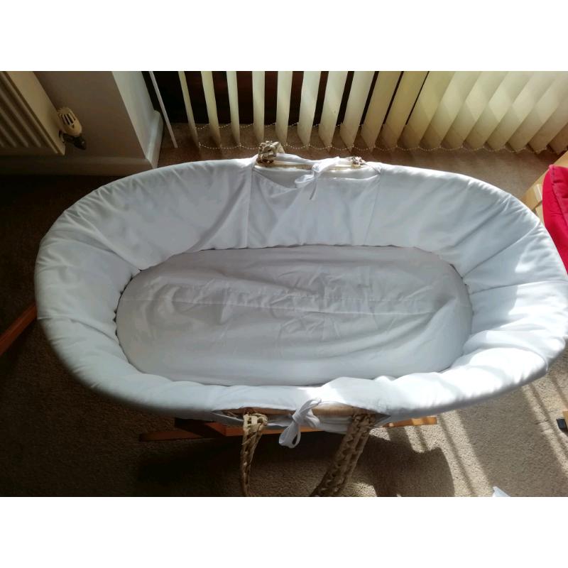 Moses basket with rocking stand.
