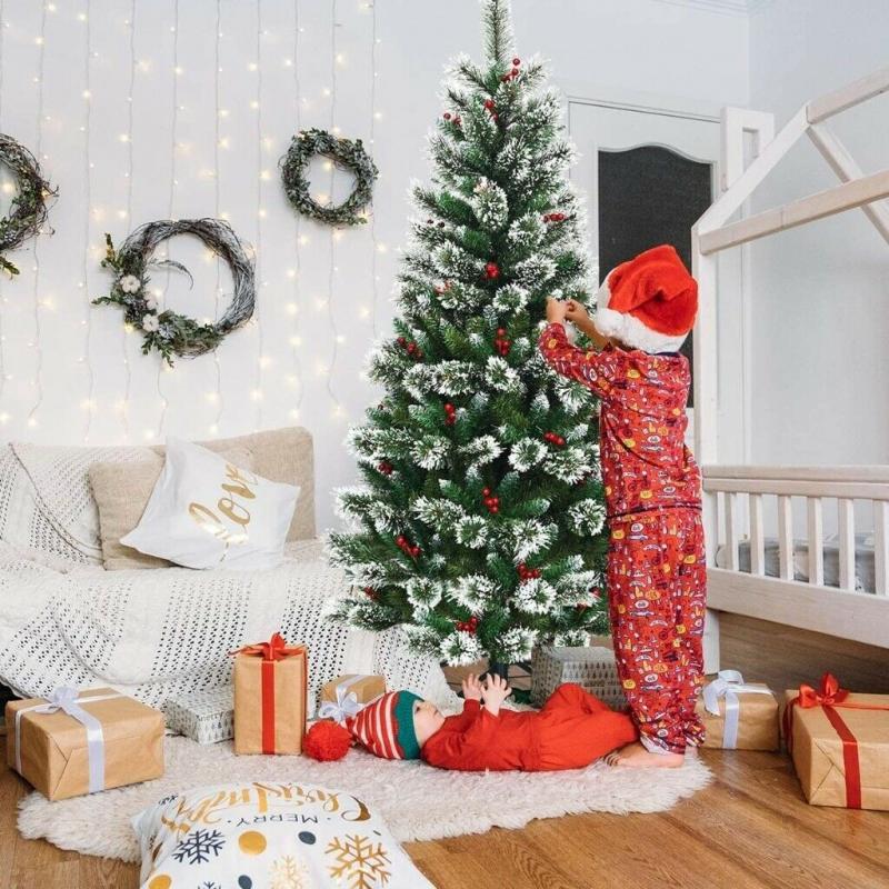 Snow Flocked Christmas Tree with Red Berries and a Metal Base available in 8ft CM2280