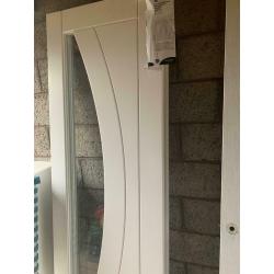 Xl joinery paired Salerno doors. White primed with clear glass