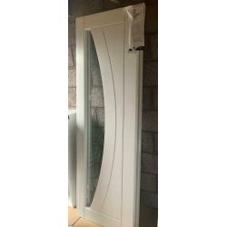Xl joinery paired Salerno doors. White primed with clear glass